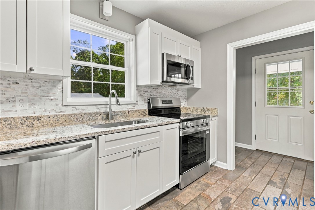 1626 Oak Ridge Road Appomattox, VA 24522 - Photo 16 of 30 Kitchen featuring white cabinetry, stainless steel