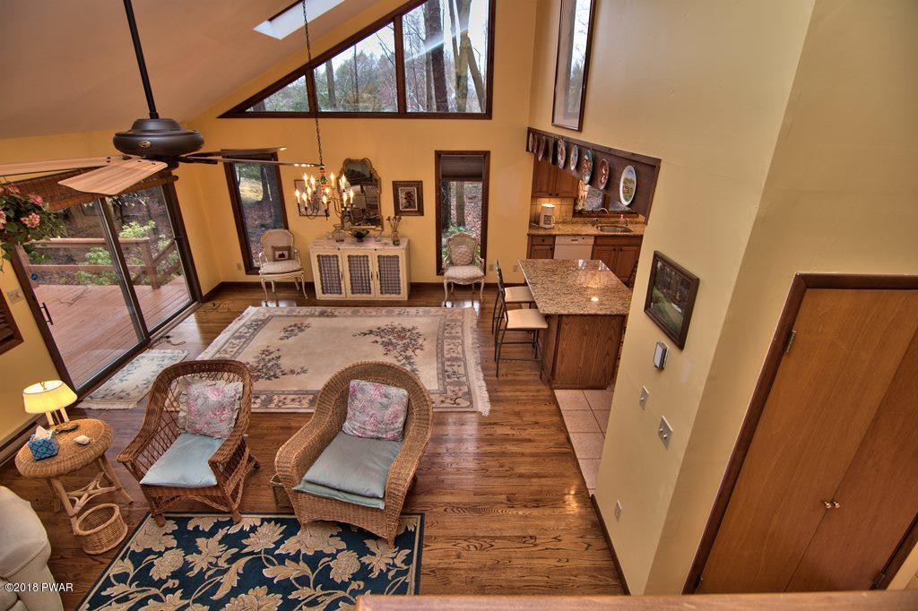 3042 Northgate Road Lake Ariel, PA 18436 - Photo 20 of 37 a view of a living room with furniture and wooden floor