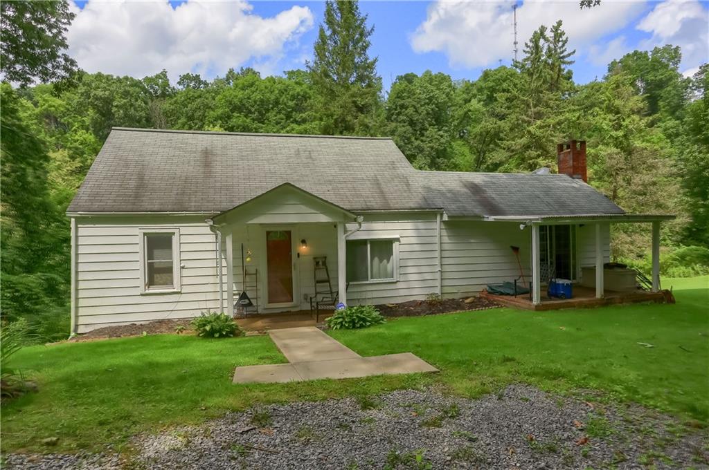 115 Chicora Road Butler, PA 16001 - Photo 1 of 10 a view of a house with a yard plants and large tree