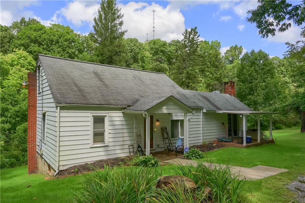 115 Chicora Road Butler, PA 16001 - Photo 2 of 10 a view of a house with a yard plants and large tree