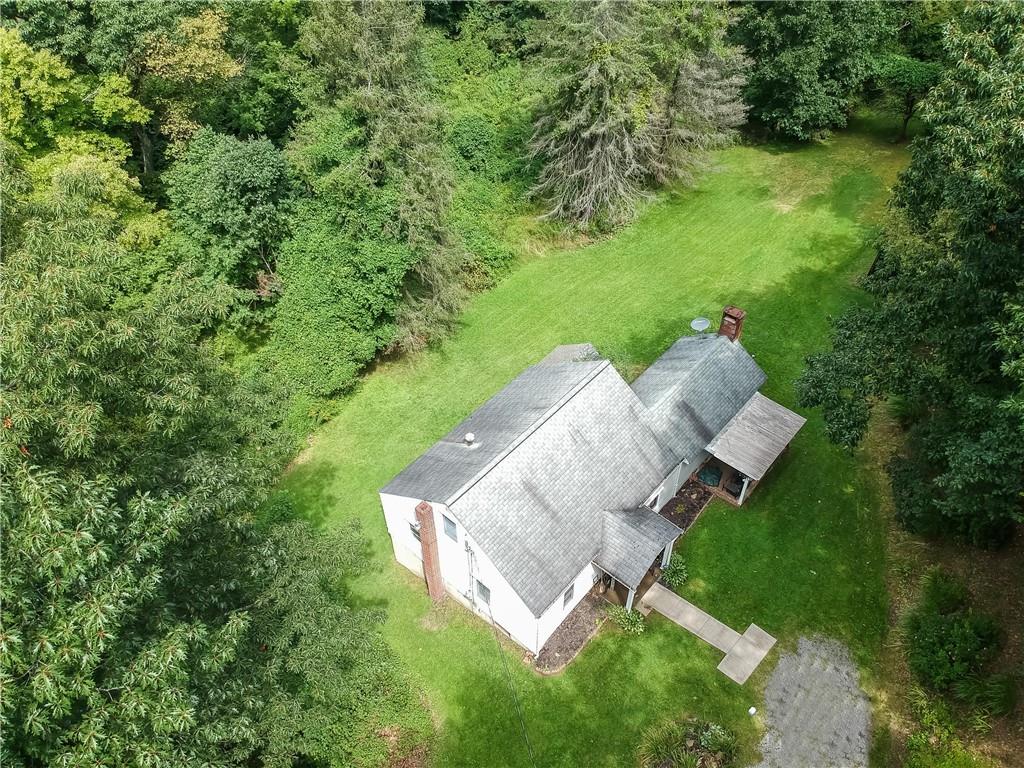 115 Chicora Road Butler, PA 16001 - Photo 3 of 10 a view of a house with a yard and sitting area