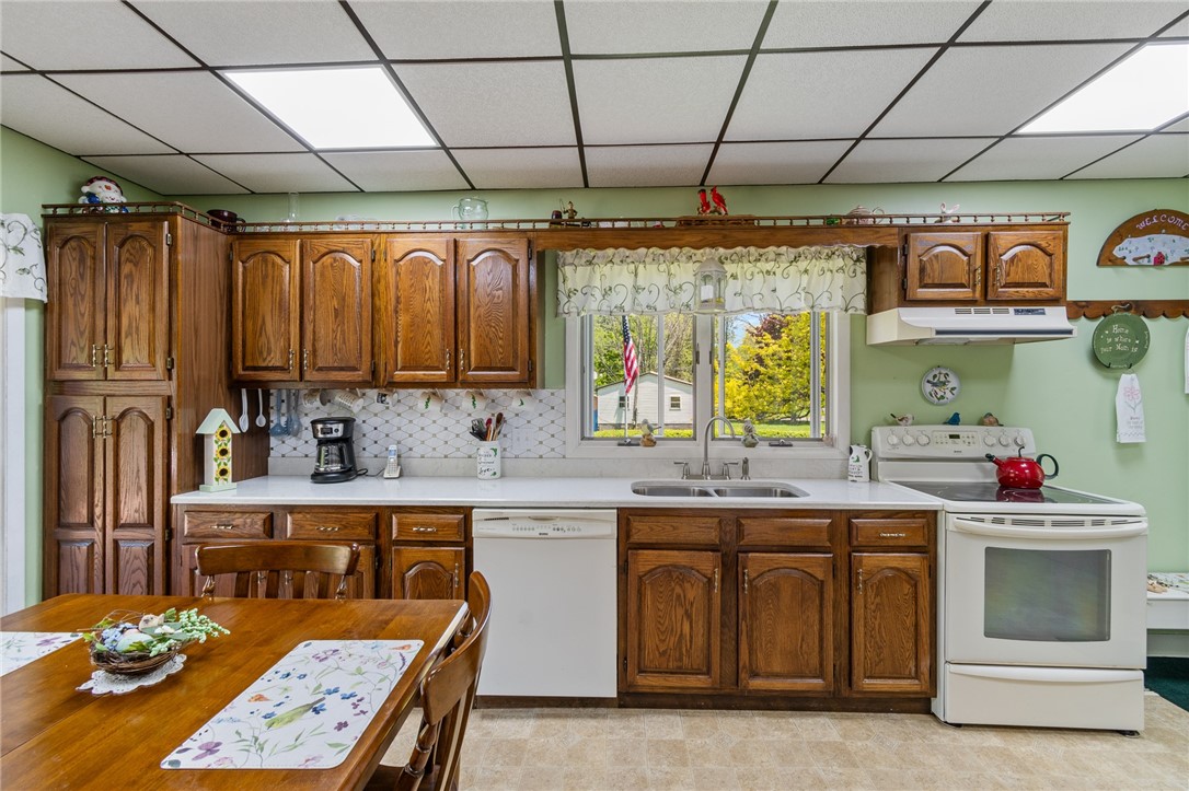 11805 Wilson Road Butler, NY 14590 - Photo 13 of 48 CUSTOM CABINETRY- SOLID SURFACE QUARTZ COUNTERS TO