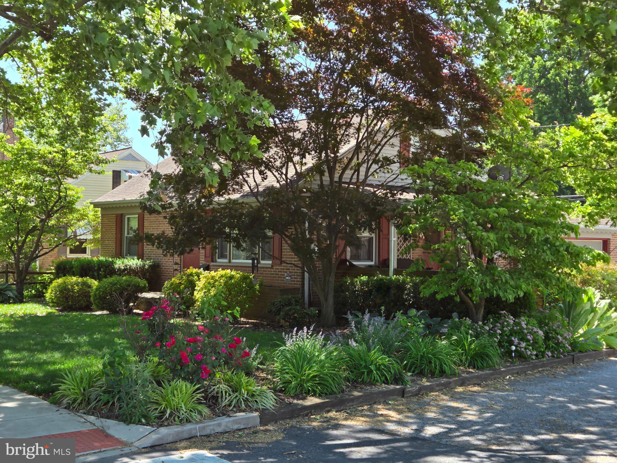 524 Locust Street Denver, PA 17517 - Photo 3 of 36 Charming home embraced by lush greenery.