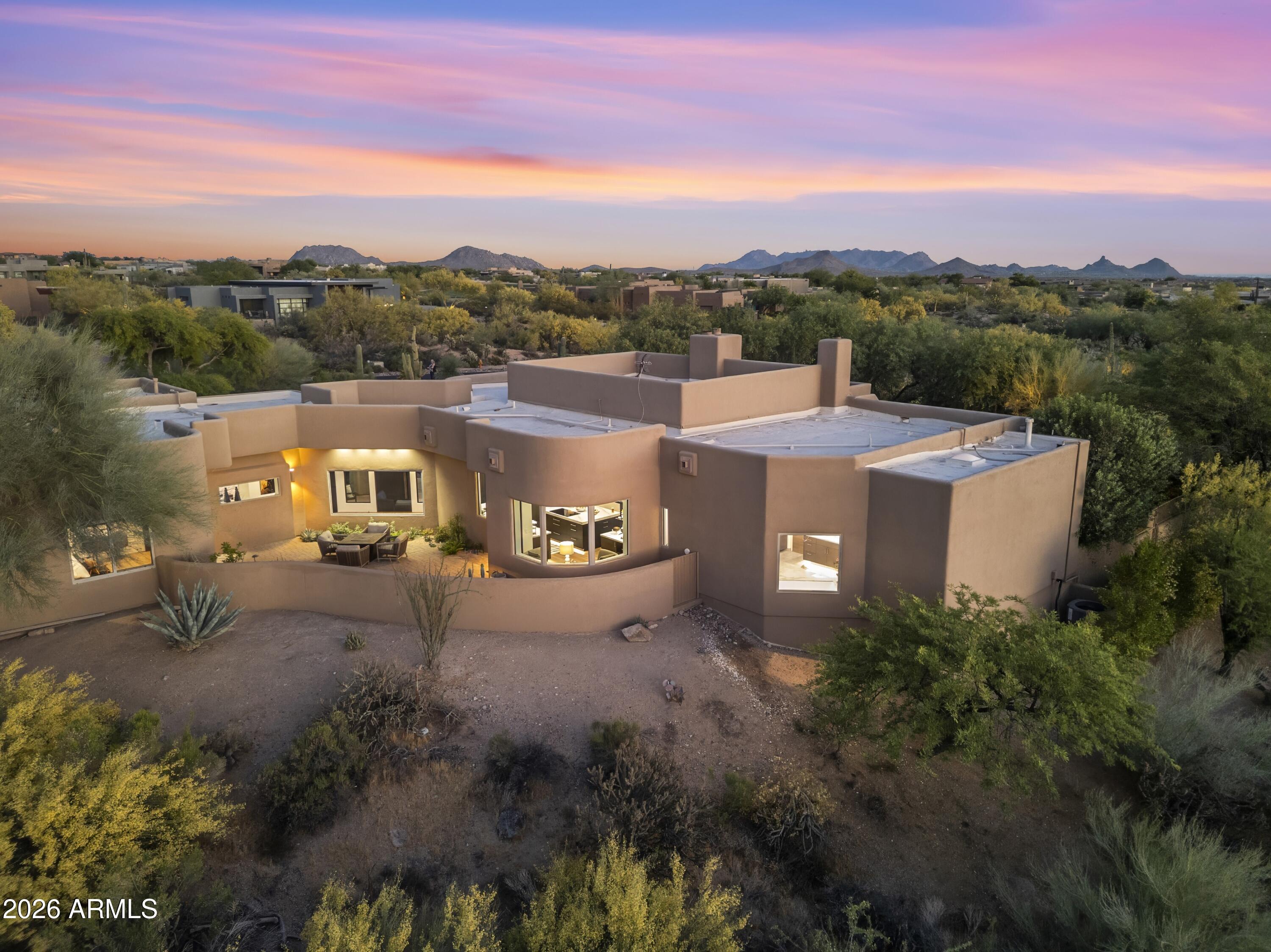 10046 East Hidden Valley Road Scottsdale, AZ 85262 - Photo 61 of 64 a view of a city with sunset