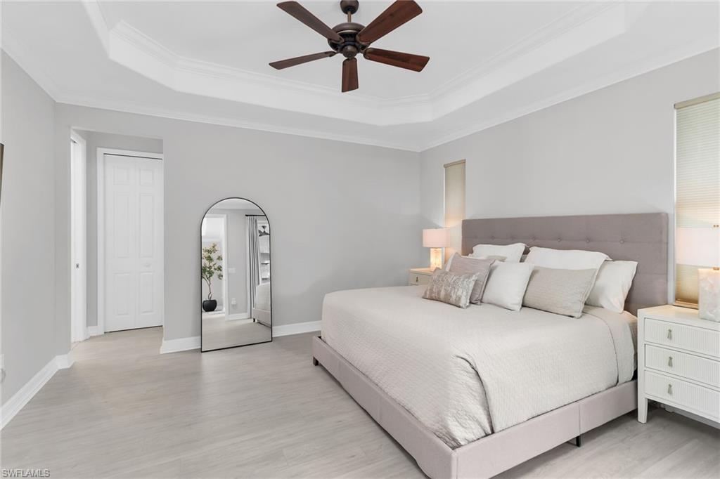 2926 Aviamar Circle Naples, FL 34114 - Photo 14 of 44 Bedroom with ceiling fan, light wood finished floors, and crown molding