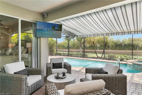 a view of a backyard with swimming pool