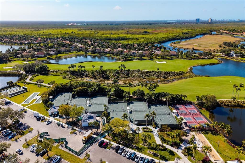 2926 Aviamar Circle Naples, FL 34114 - Photo 38 of 44 Aerial perspective of suburban area with a golf club and a large body of water