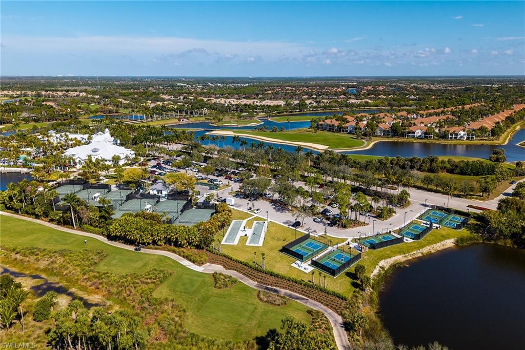 2926 Aviamar Circle Naples, FL 34114 - Photo 39 of 44 Aerial perspective of suburban area with a nearby body of water and a local golf course