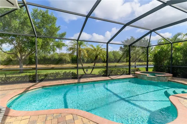 a view of a backyard with sitting area