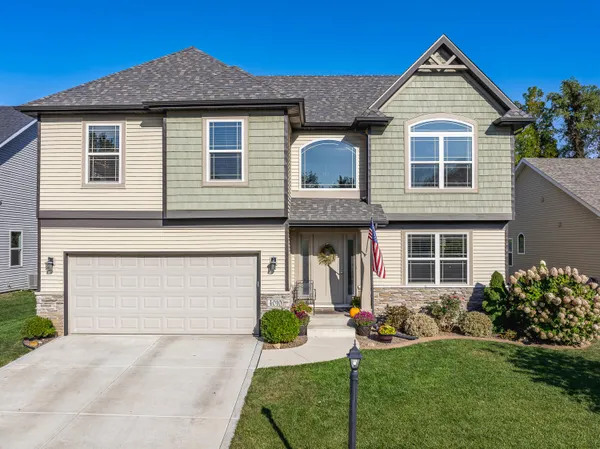 a front view of a house with garden
