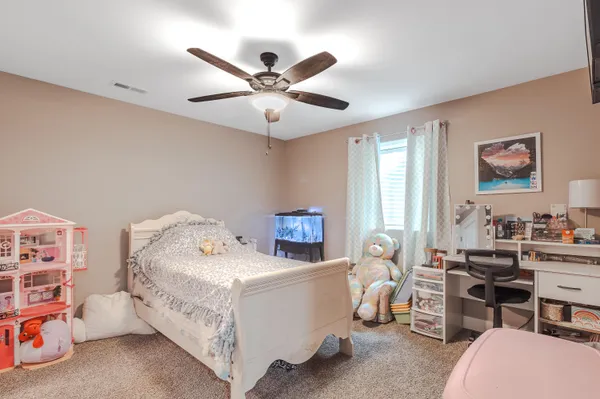 a bed room with a bed and a window