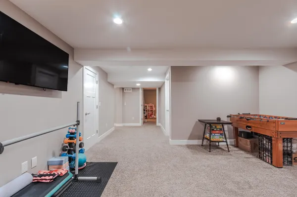 a view of a livingroom with furniture and a flat screen tv