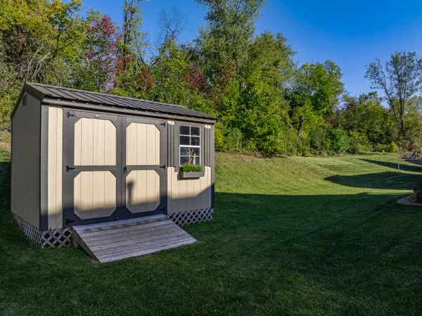 an aerial view of a house with lake view
