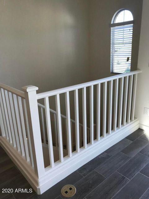 4038 East Erie Street, Unit 101 Gilbert, AZ 85295 - Photo 5 of 7 a view of wooden floor and a window