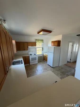 a view of livingroom with furniture and window