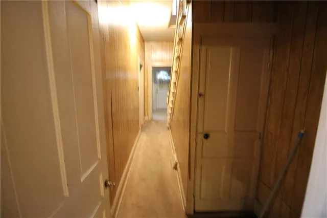 a view of a bathroom from the hallway