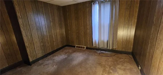 a view of a room with a wooden door