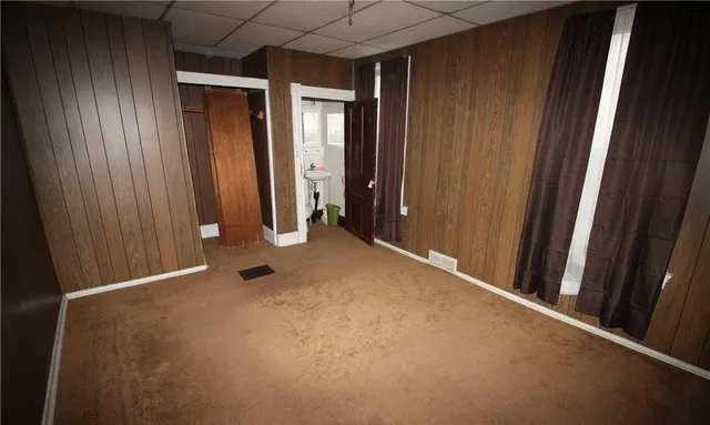 a white toilet sitting next to a sink