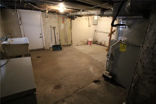 a view of a house with a yard covered with snow in front of house