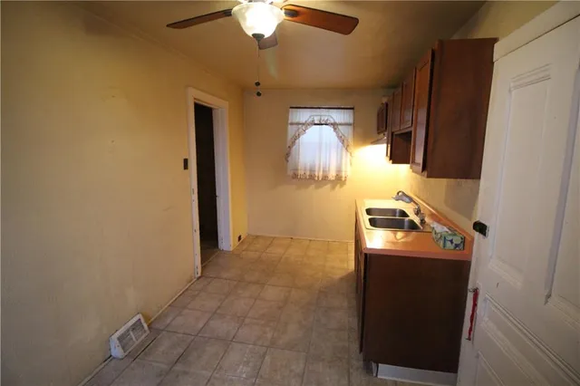a room with a stove and a refrigerator