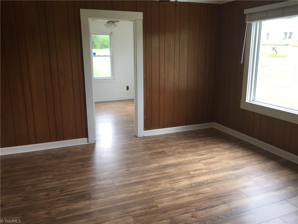 590 Ball Road Thomasville, NC 27360 - Photo 8 of 18 Den looking into 2nd bedroom, new flooring