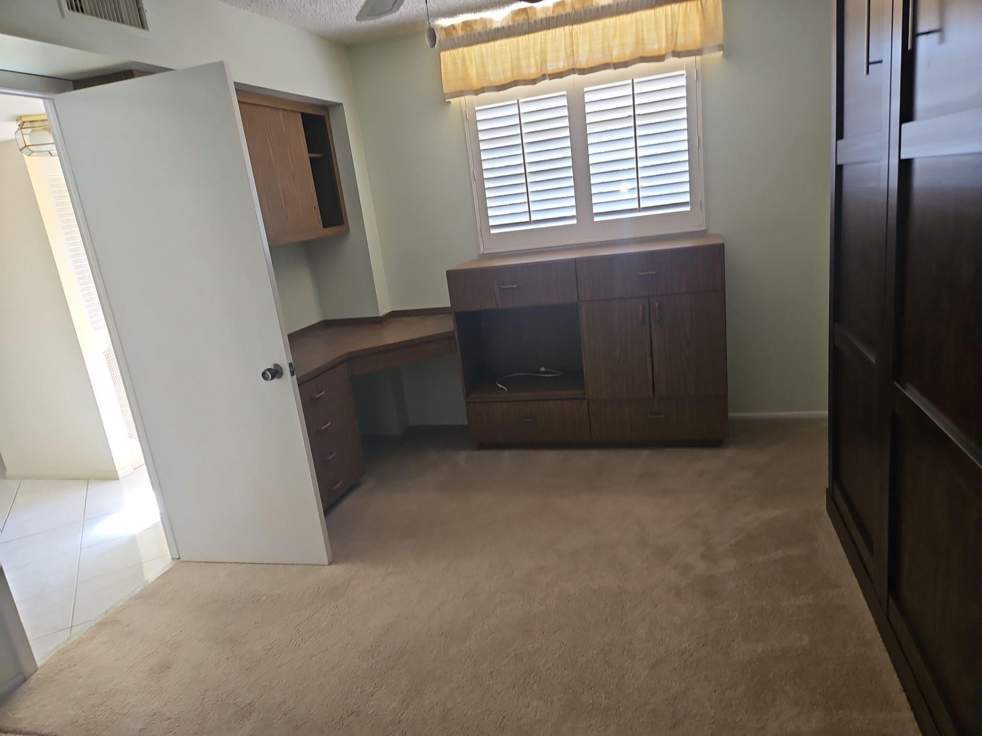 5201 Northwest 2nd Avenue, Unit 114 Boca Raton, FL 33487 - Photo 11 of 19 a view of an empty room with a window