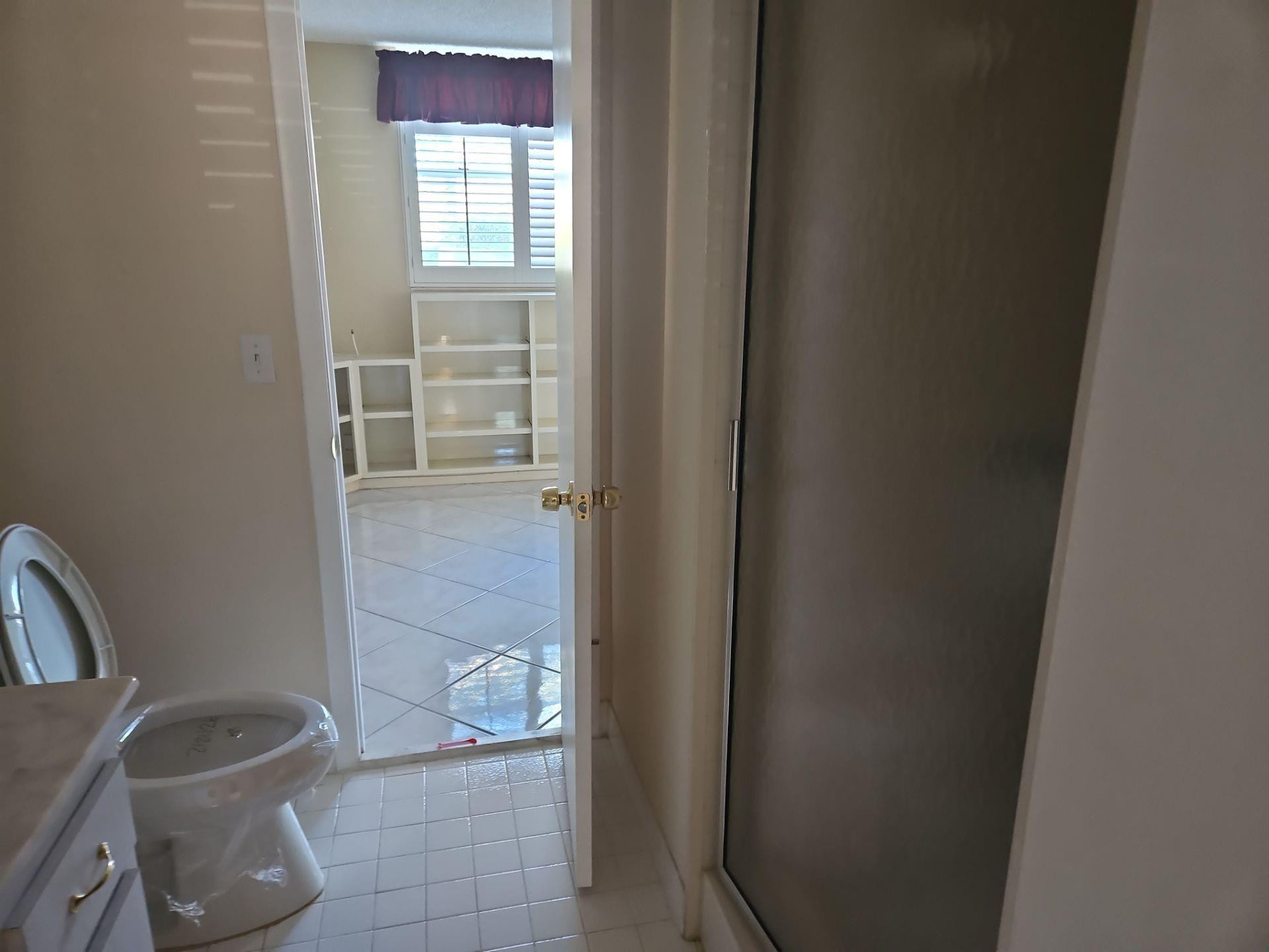 5201 Northwest 2nd Avenue, Unit 114 Boca Raton, FL 33487 - Photo 12 of 19 a bathroom with a toilet