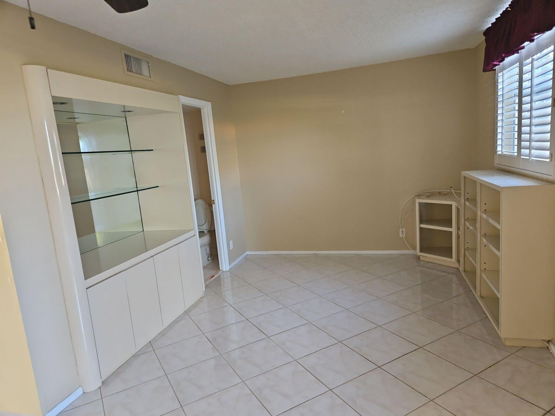 5201 Northwest 2nd Avenue, Unit 114 Boca Raton, FL 33487 - Photo 14 of 19 an empty room with windows