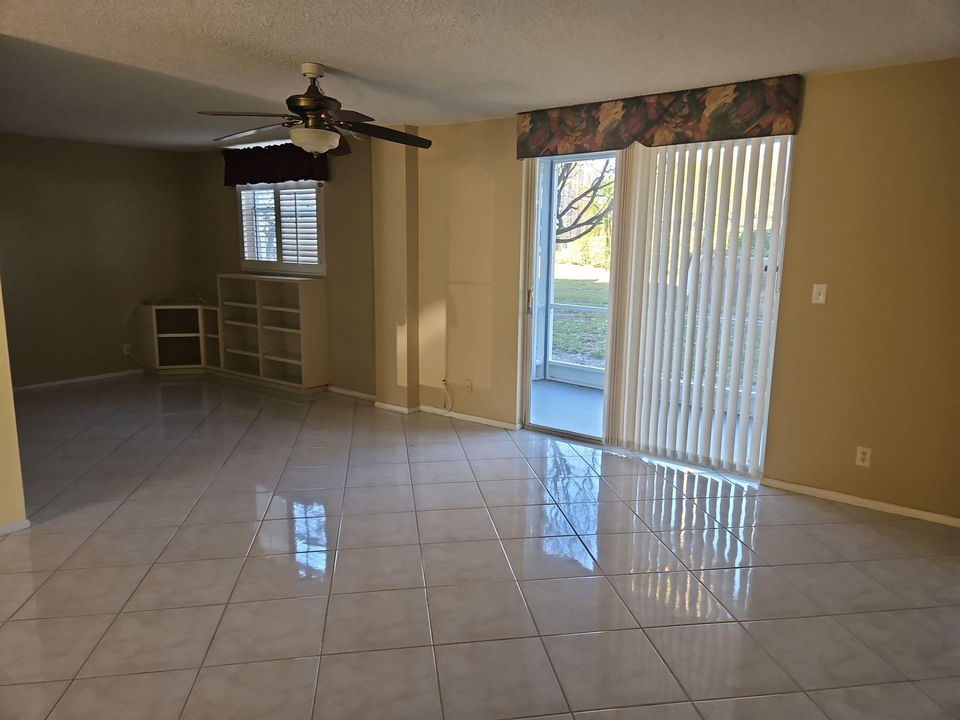 5201 Northwest 2nd Avenue, Unit 114 Boca Raton, FL 33487 - Photo 15 of 19 a view of a livingroom with furniture and windows