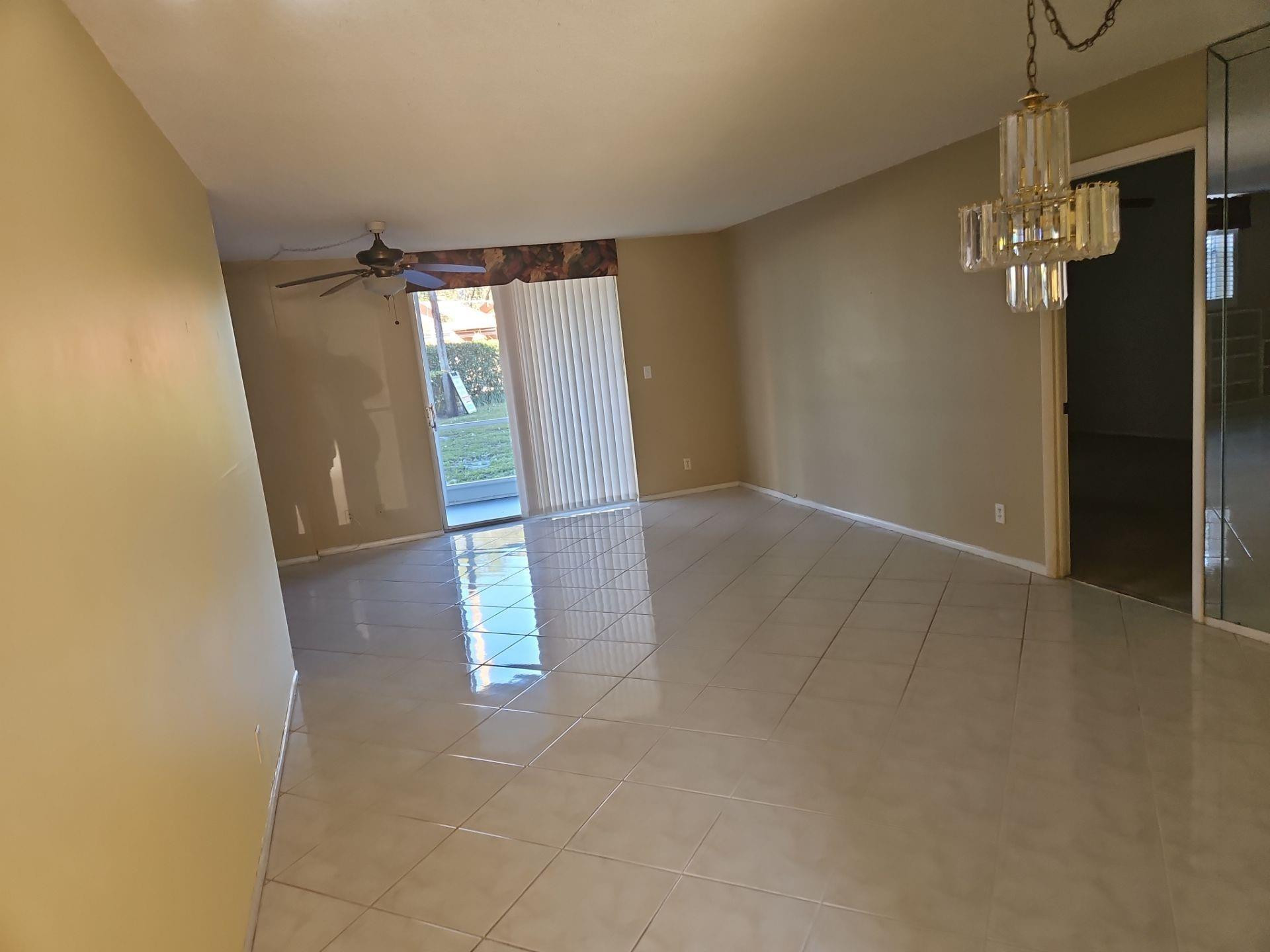 5201 Northwest 2nd Avenue, Unit 114 Boca Raton, FL 33487 - Photo 19 of 19 an empty room with windows