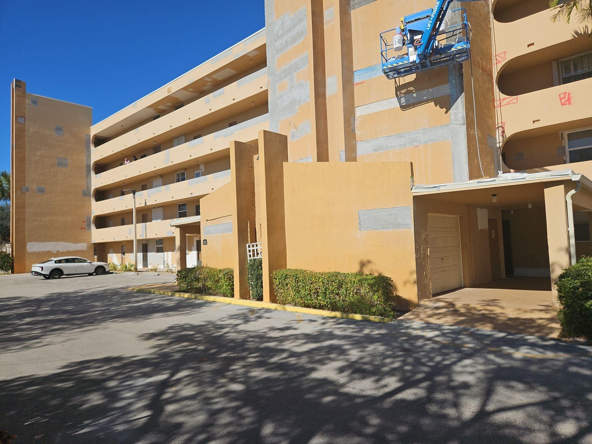 5201 Northwest 2nd Avenue, Unit 114 Boca Raton, FL 33487 - Photo 2 of 19 a view of a street with house
