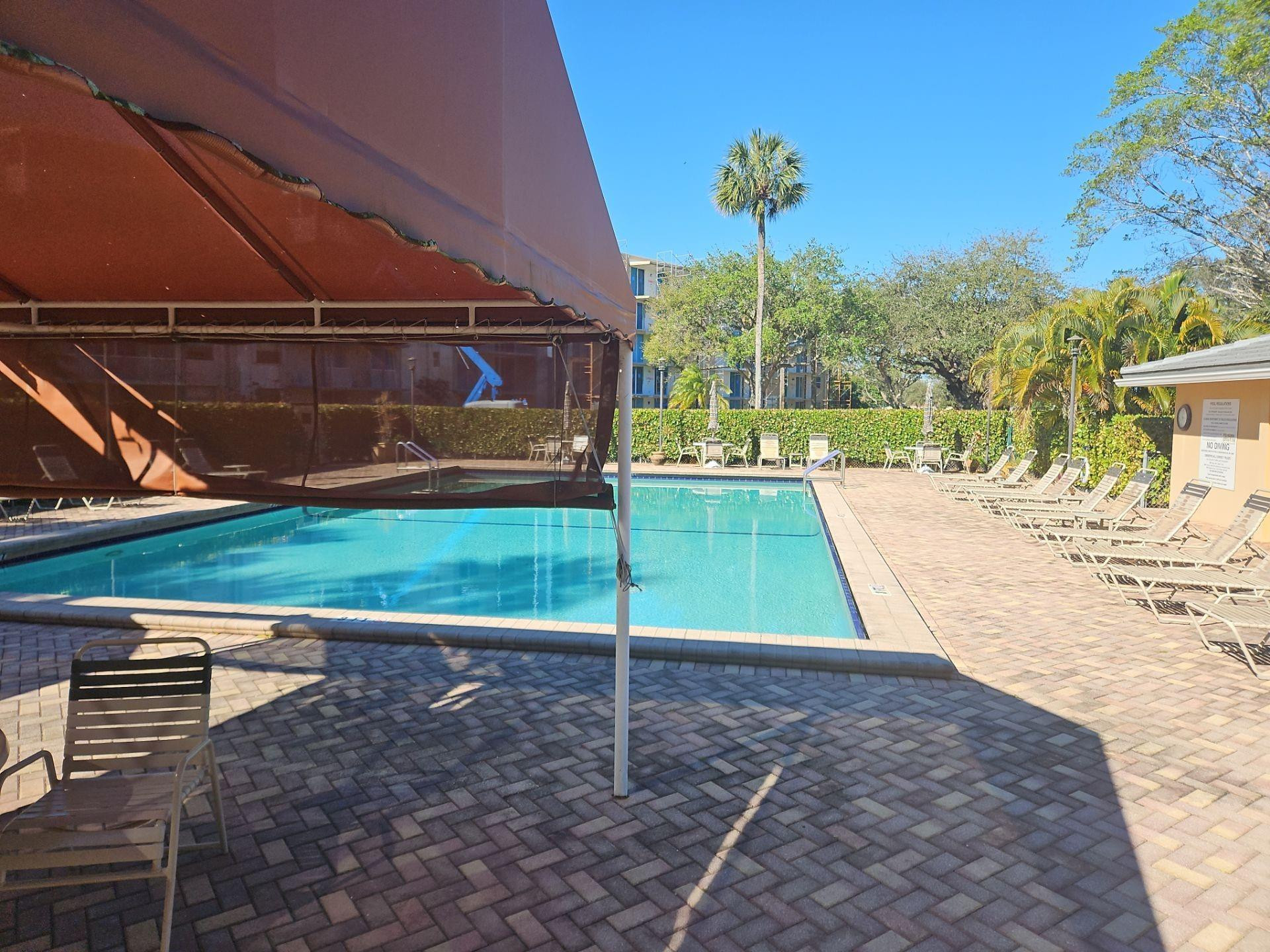 5201 Northwest 2nd Avenue, Unit 114 Boca Raton, FL 33487 - Photo 3 of 19 a view of a backyard