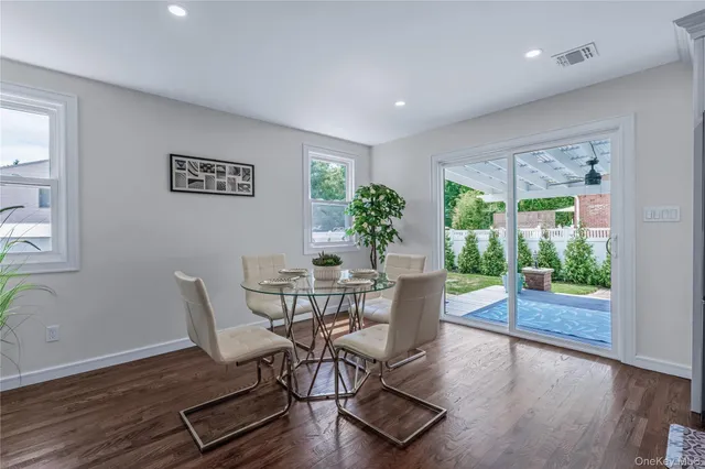 a view of a livingroom with furniture and wooden floor