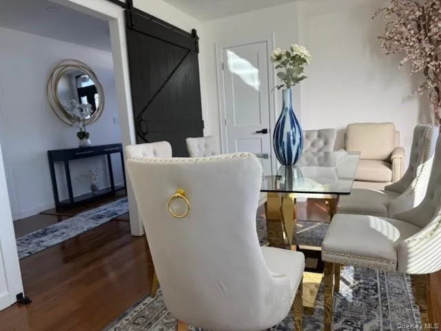 a living room with furniture and a mirror