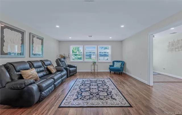 a living room with furniture and a rug