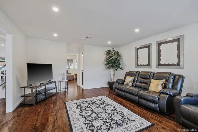 a living room with furniture and a rug