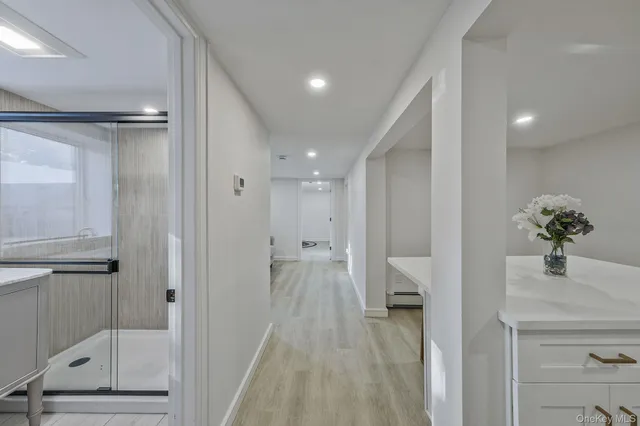 a kitchen with a sink a refrigerator and cabinets