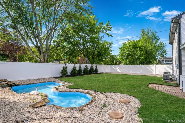 a view of a garden with a house
