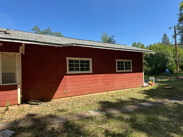 a backyard of a house with lots of green space