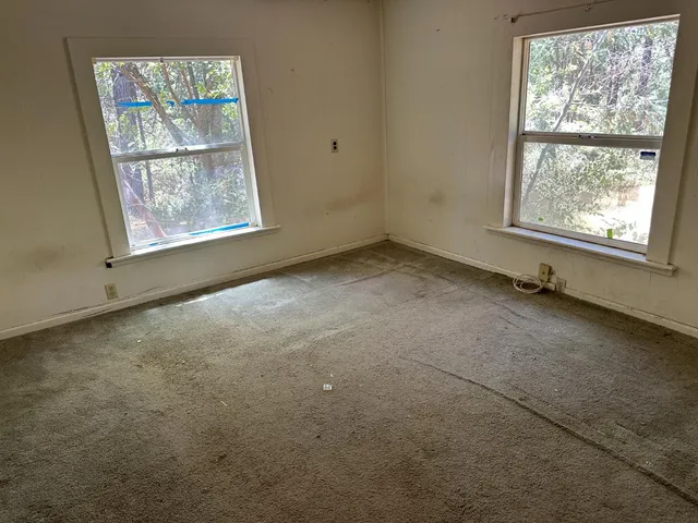 an empty room with windows