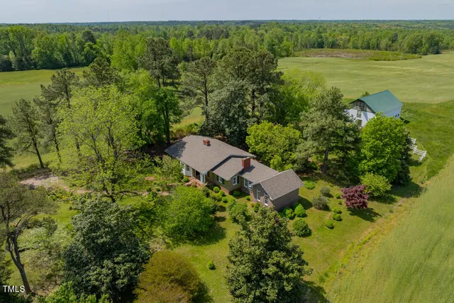 a view of a field with an trees