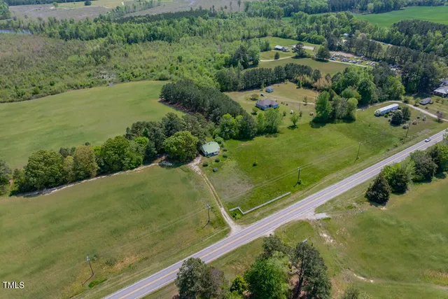a view of a room with furniture and wooden floor
