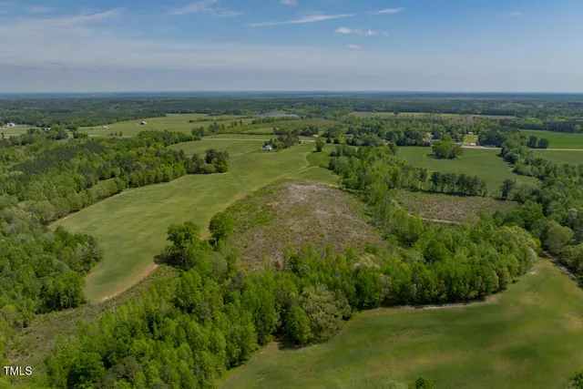 a backyard of a house with a yard and lake view