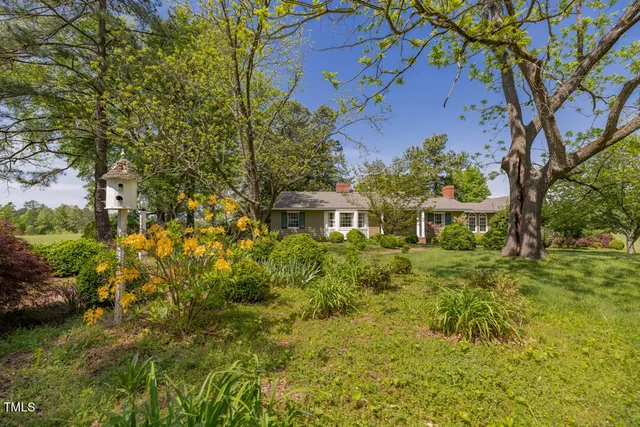 a view of a lake with houses in the back