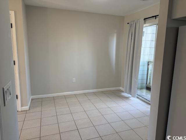 425 Myrtle Greens Drive, Unit B Conway, SC 29526 - Photo 11 of 18 Spare room with plenty of natural light and light tile patterned floors