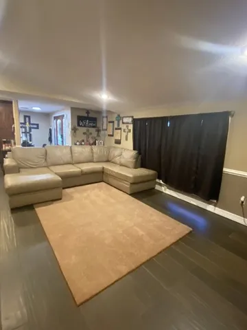 a bed sitting in a room next to a window