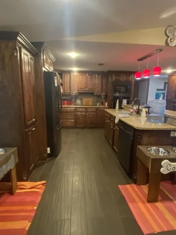a kitchen with sink cabinets and counter top space