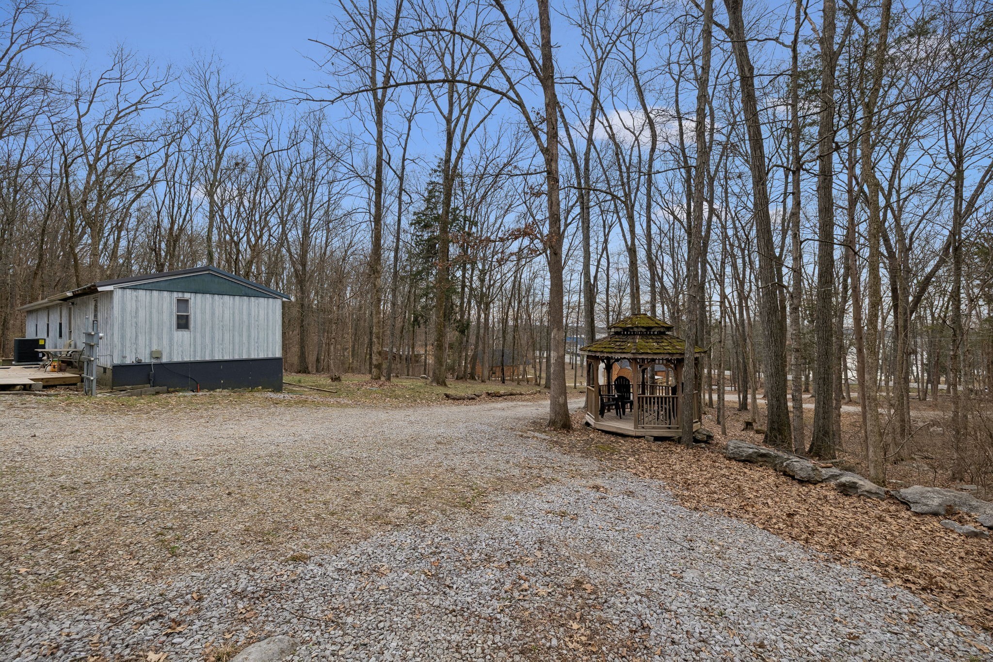 3726 Benders Ferry Road Mount Juliet, TN 37122 - Photo 12 of 25 a view of a house with a large tree and wooden fence