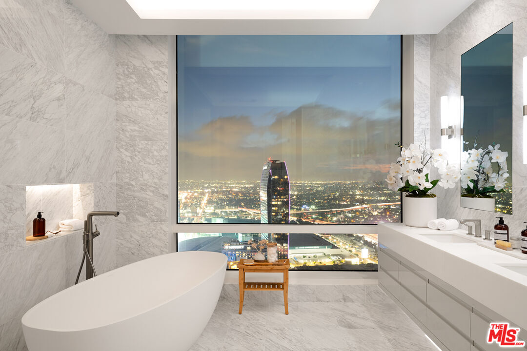 1000 West 8th Street, Unit PH5805 Los Angeles, CA 90017 - Photo 13 of 56 a living room with furniture and a large window