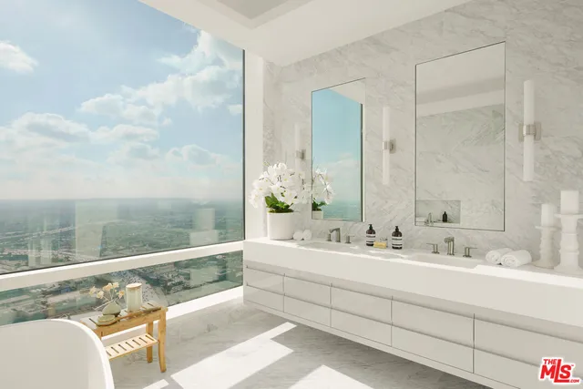 a bathroom with a double vanity sink and a mirror